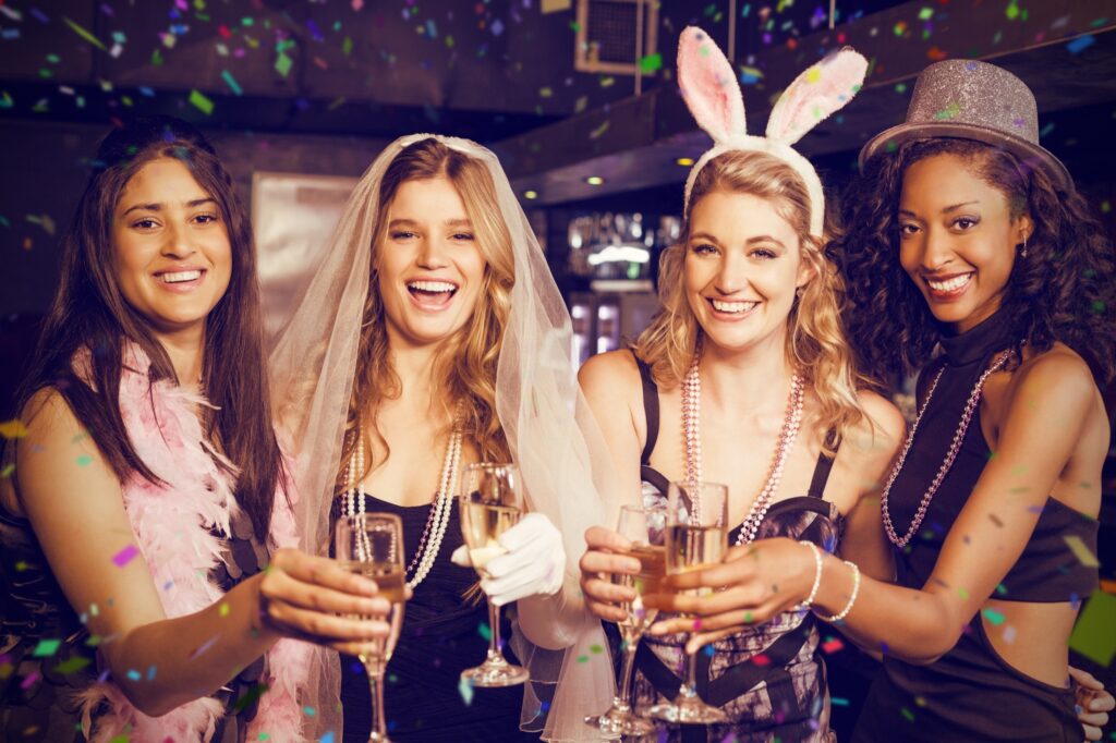 Friends toasting champagne at a bachelorette party