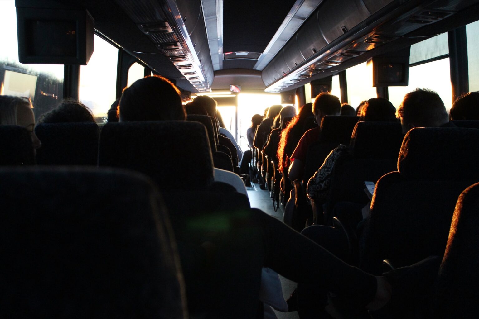 Passengers riding a coach bus