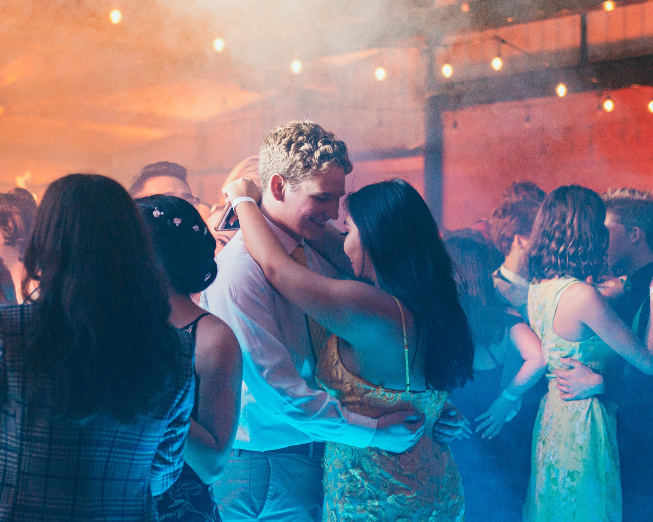 A couple dancing together at prom