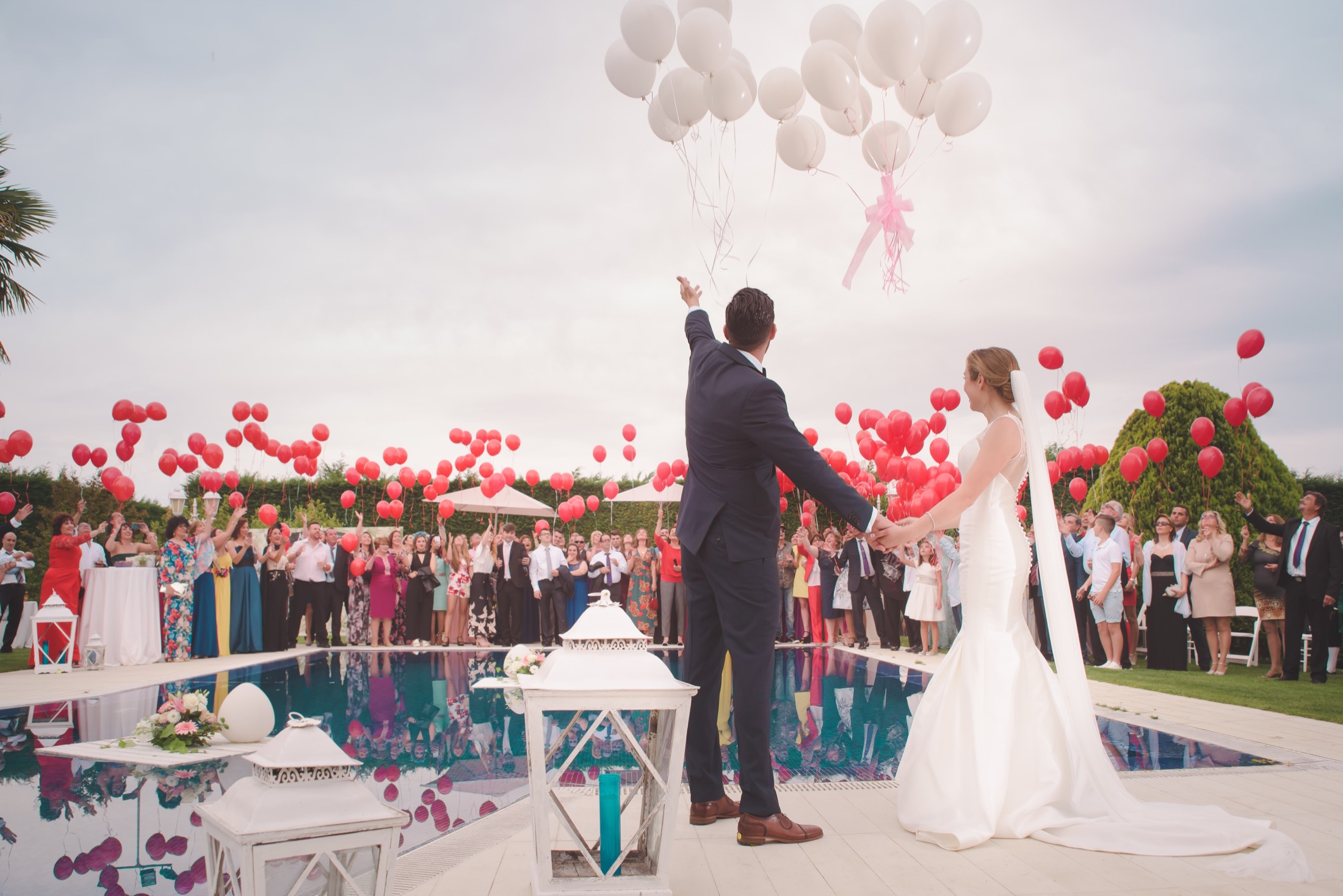 A wedding celebrating by releasing balloons