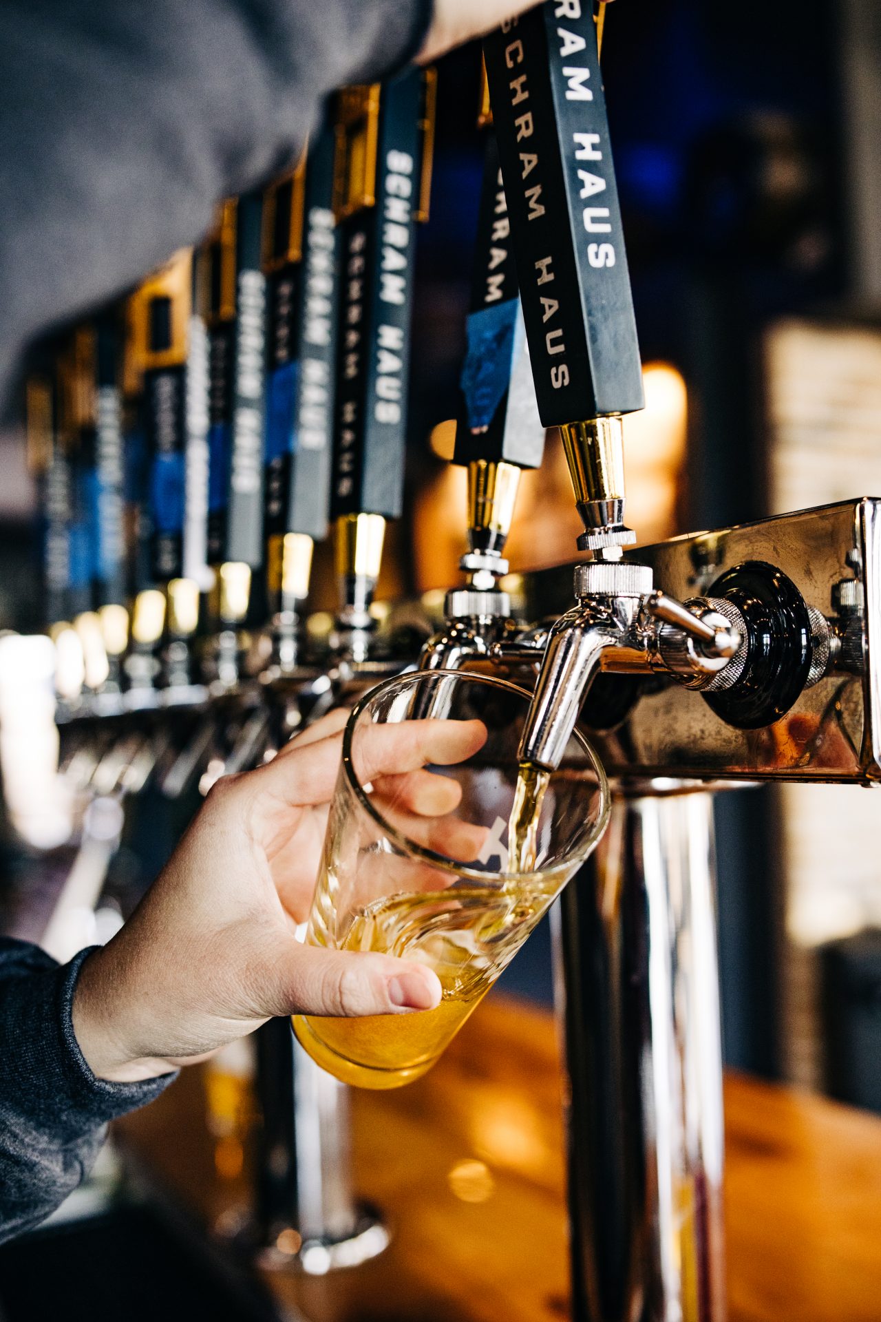 A glass of beer being professionally poured