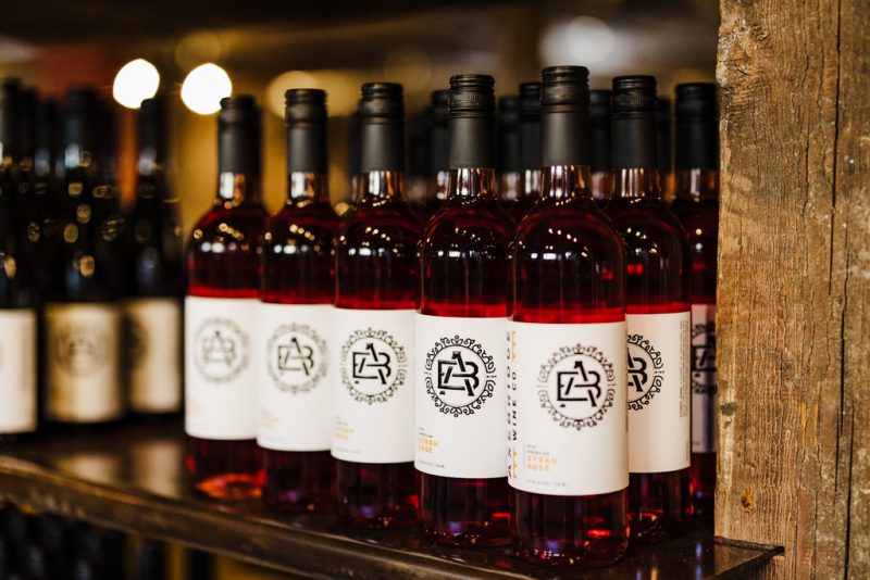 Bottles of wine being stored on a shelf