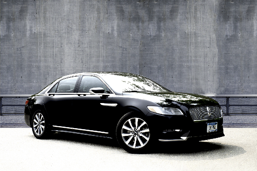 Regular sedan limousine, four-door and suitable for 2 adult passengers comfortably in the back seat.