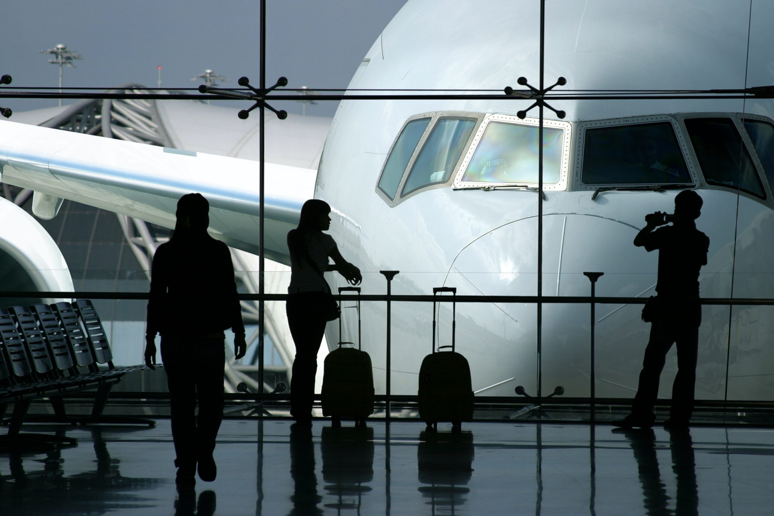 Travelers waiting to board their flight at the airport.