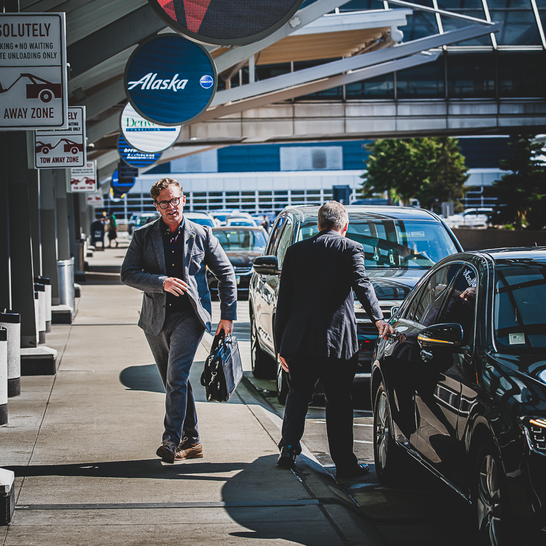 Traveller arriving at the MSP Airport Departures area after a ride with Executive Transportation