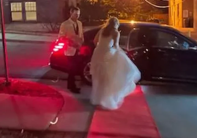 Happy bride and groom end their night with a red-carpet getaway from the reception.