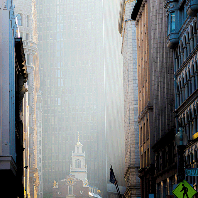 narrow streets of boston with a view to the historical Old State House.