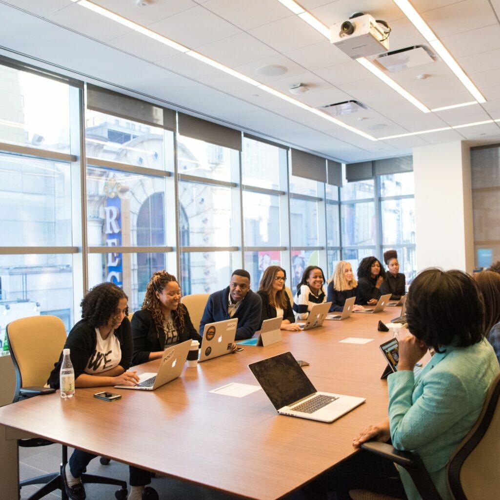 A group of employees attend a meeting