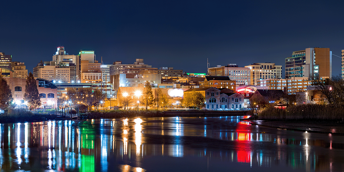 Looking into the vibrant city along the coast at night in Delaware.