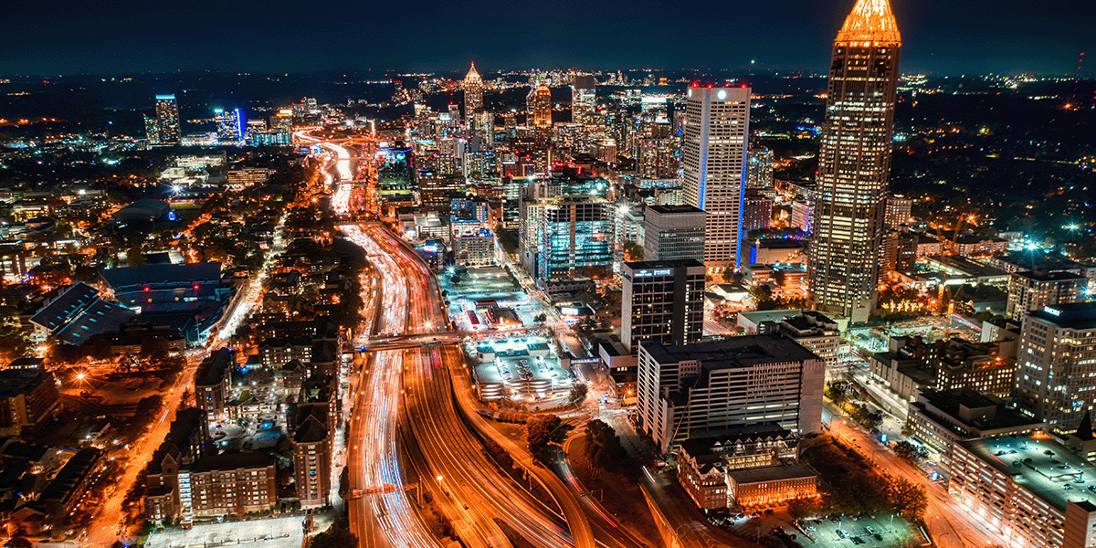 View of downtown Atlanta at night with the busy highways in the forground.