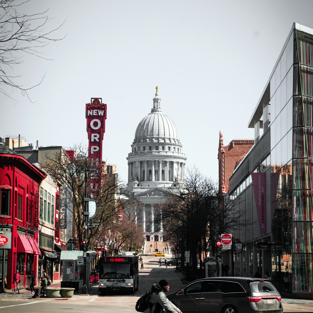 Vibrant downtown Madison street framing the capitol building in the background