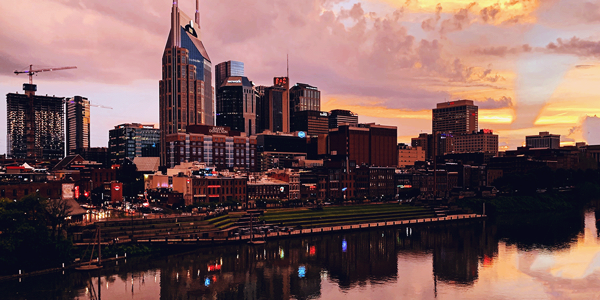 Nashville skyline reflected in the river at twilight.