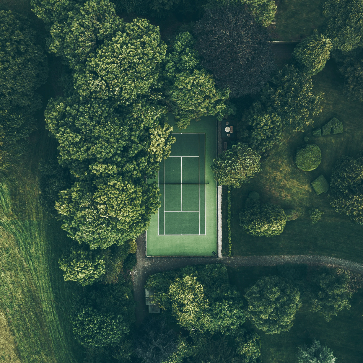 Aerial photo of a grass tennis court representative of the additional amenities available at Sand Valley Resort