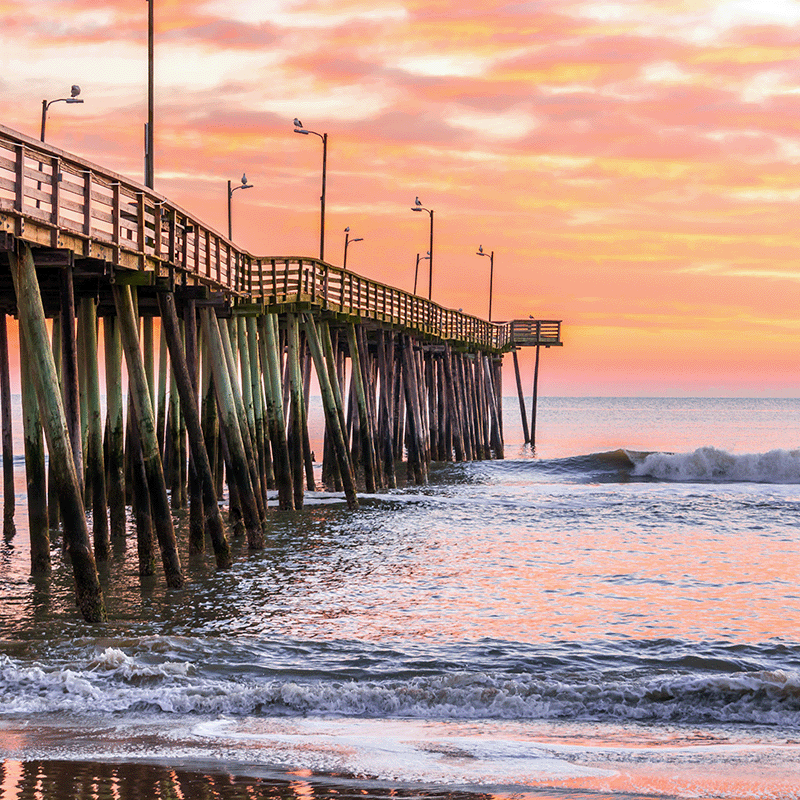 Relaxing view of the Virginia Beach fishing pier at sunrise.