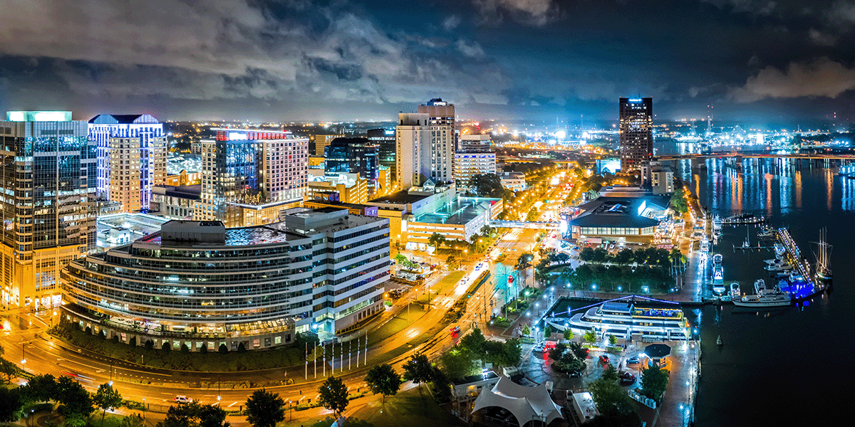 Night skyline over the edge of Norfolk, Virginia with the harbor in view.