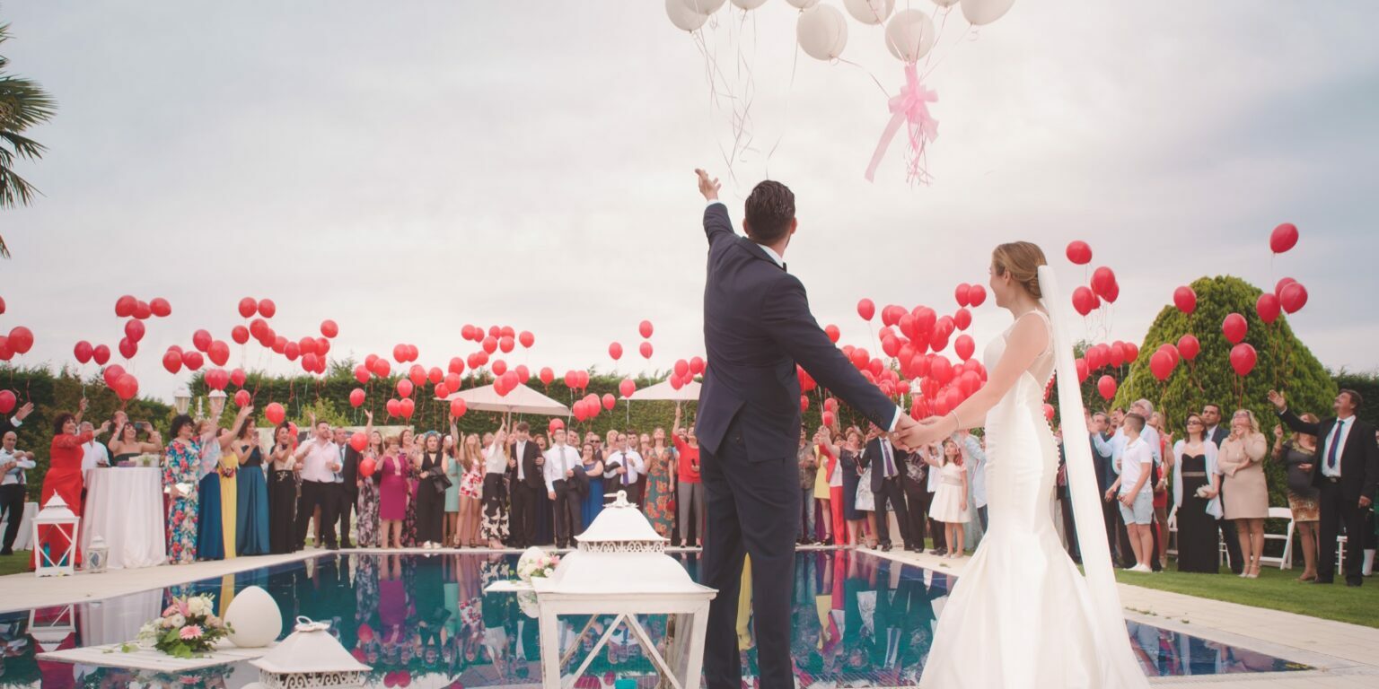 A wedding celebrating by releasing balloons