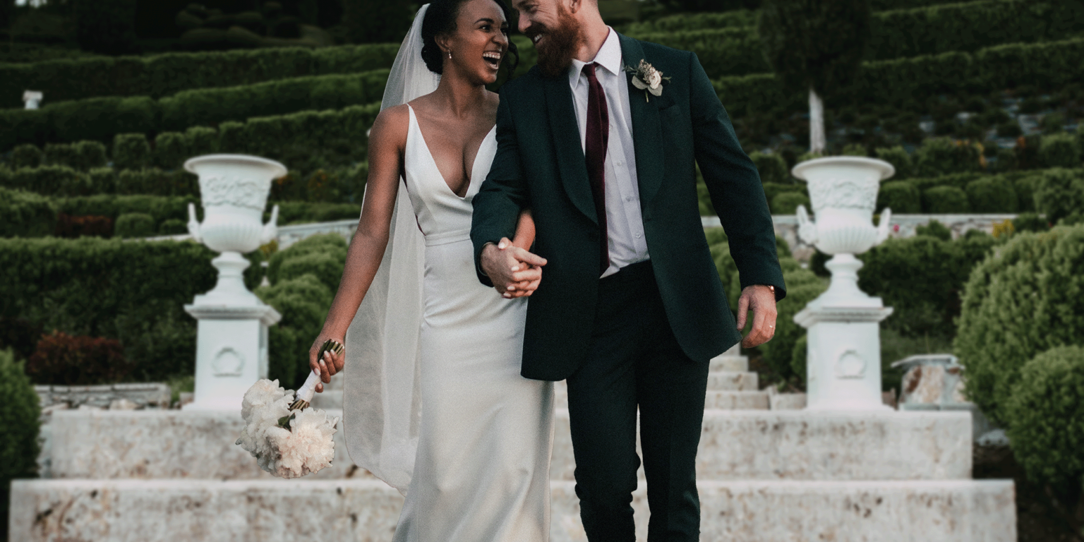 Wedding couple heading toward their chauffeur