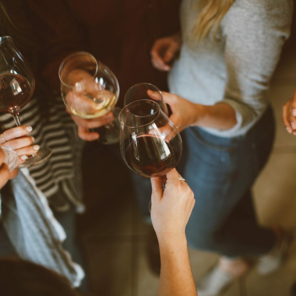 Friends sharing wine together